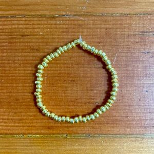 I am selling a gold beaded bracelet which can stretch to fit any wrist.